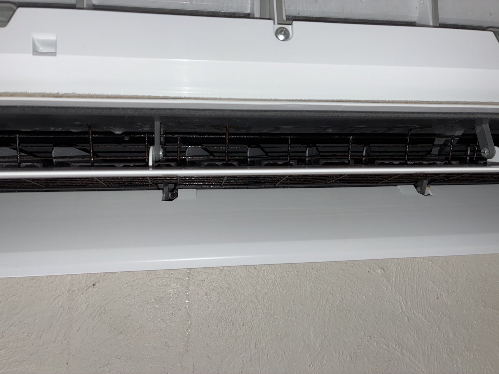 Same split system after ACcleanQLD hydro-chemical clean — clean barrel fan and vanes